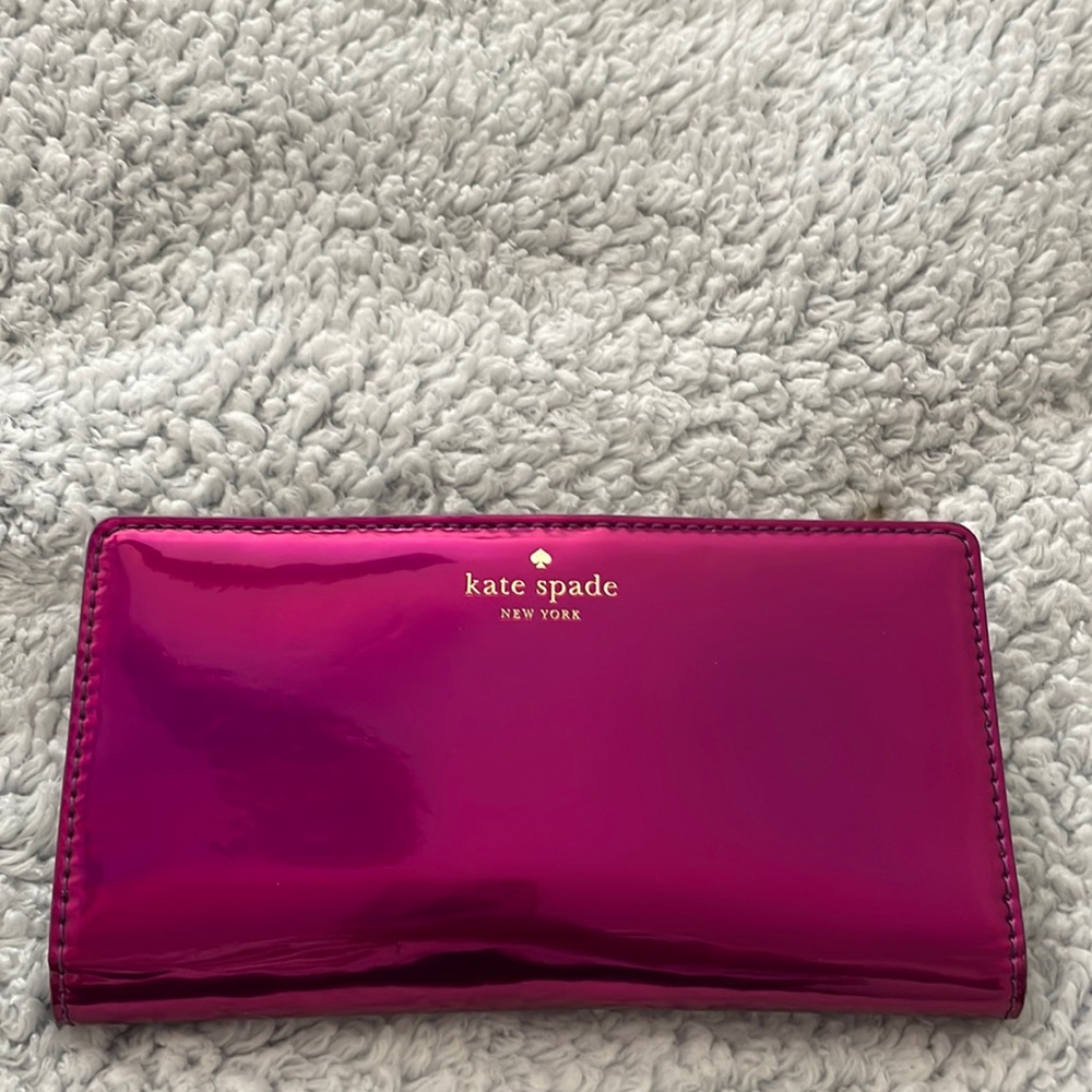 Kate Spade hot pink wallet with 13 card slots and pocket for coins. Barely used